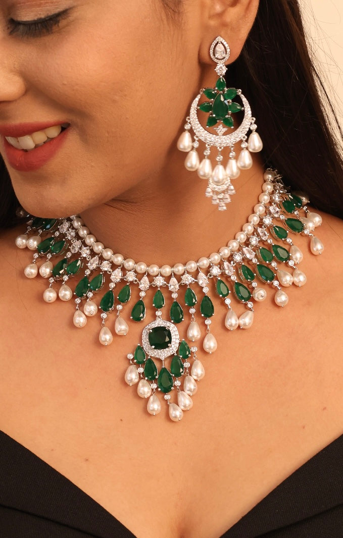 Close-up of emerald and pearl necklace set with matching maangtikka and earrings